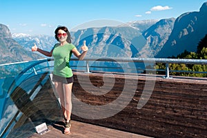 Excited woman tourist at Stegastein Viewpoint