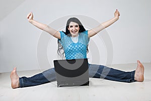 Excited woman using laptop