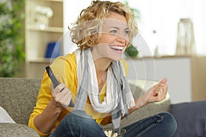 excited woman watching tv