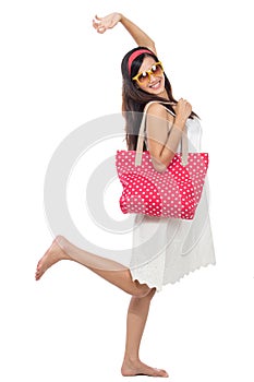 Excited woman in white dress raise her arm