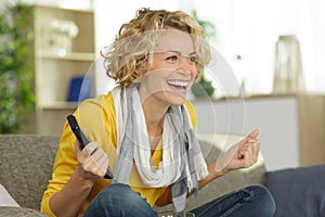 Excited woman winning online prize