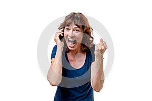 Excited woman yelling on her mobile phone