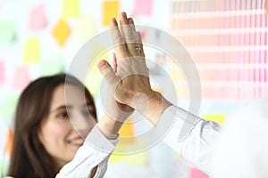 Excited workers in office crossed arms in pile