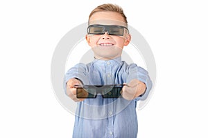Excited young american schoolboy in 3d imax glasses posing on white isolated background in studio photo