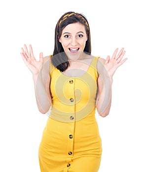 Excited young girl with opened hands, isolated on white background. Yes concept. Good news. Rejoicing woman celebrates success