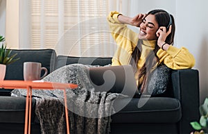 Excited young girl woman, laughing while listening to music