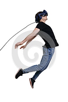 Excited young male in VR glasses flying through spase. Using VR headset, white background