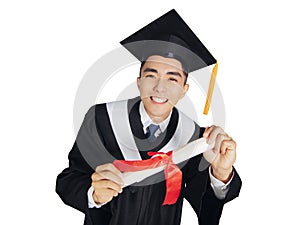 Excited young man in  black graduation gown and cap  showing diploma