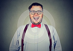 Excited young man in bow-tie