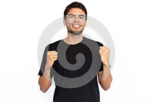 Excited young man with clenched fists