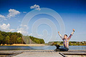 Excited young man using laptop