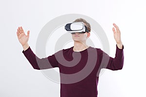 Excited young man in a VR headset, glasses . Virtual reality isolated on white background. Copy space and mock up