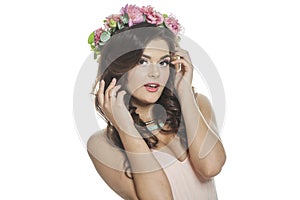 Excited young model with long curly hair, makeup and perfect healthy skin, floral blossom portrait. Spring beauty, cosmetology