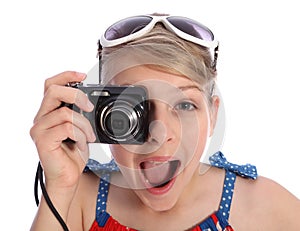 Excited young photographer girl taking pictures