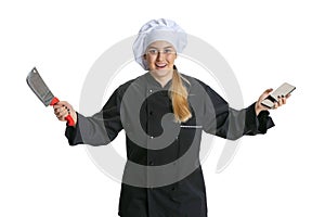 Excited young woman, lady-cook, chef in black uniform isolated on white background. Cuisine, profession, business, food