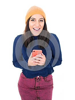 Excited young woman reading good news on mobile phone, isolated on white background. Surprised trendy girl holds smarthphone