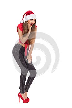 Excited young woman in santa's hat