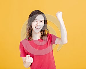 Excited young Woman with success gesture