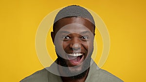 Excitement Concept. Portrait Of Happy Excited Black Man Opnenin Mouth In Amazement