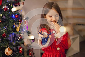 Excitement near christmas of small kid with santa costume