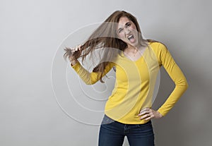 Excitement and pain concept for angry 20s girl photo