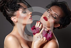 Excitement. Two Provocative Amorous Dreamy Women in Foreplay Game photo