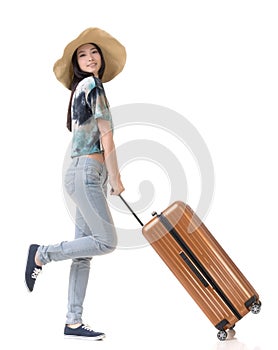 Exciting Asian woman drag a luggage