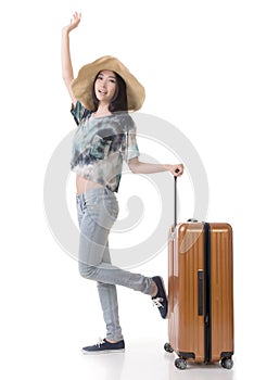 Exciting Asian woman drag a luggage