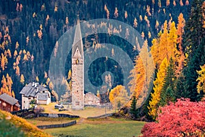 Exciting autumn long focus view of ruine San Genesio church
