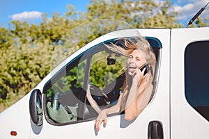 Exciting Blond Female At The Wheel Speaking By