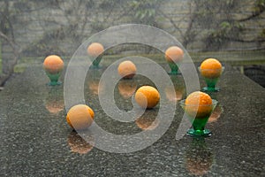 Exciting downpour and eight oranges