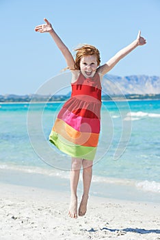 Exciting little girl at sea beach