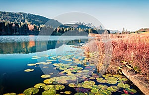 Exciting morning scene of Wagenbruchsee lake with Zugspitze mountain range on background. Beautifel autumn view of Bavarian Alps,