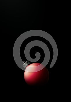 Exciting Studio shot of a modern matte red Christmas ball