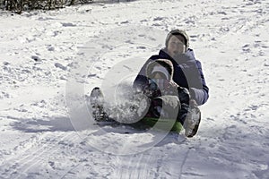 Exciting tobogganing with grandmother