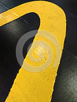 Exciting yellow and black graphic texture painted on rough surface.