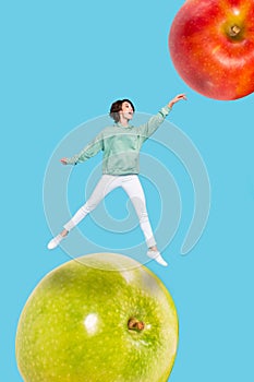 Exclusive dynamic magazine sketch collage of lady jumping touching huge big red green apples isolated blue colorful