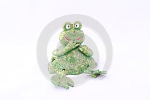 The exclusive frog figurine is hand-made