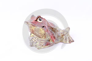 The exclusive frog figurine is hand-made