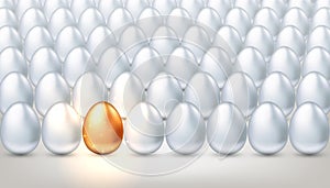 Exclusive golden egg in a crowd of ordinary white eggs, the concept of creativity, exclusivity, success. Bright individuality