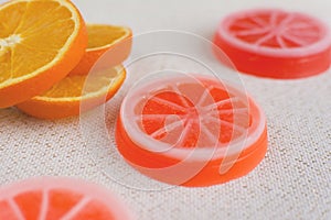 Exclusive orange handmade soaps. Fresh orange slices on the back