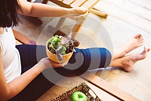 Excretory good system concept,Woman hands holding and eating healthy salad for breakfast in the morning
