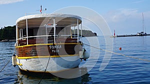 Excursion boat anchored in marina