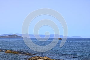 Excursion boat cruising Venetian harbour and mediterranean sea of Chania, Crete, Greece
