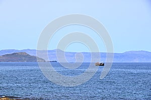 Excursion boat cruising Venetian harbour and mediterranean sea of Chania, Crete, Greece