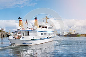 Excursion boat leaving harbor on the island of Sylt, Germany