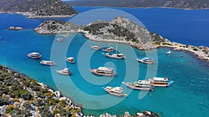 Excursion boats take a swimming break in Aquarium Bay Kekova in Turkey