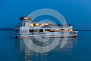Excursion ship on Lake Balaton at night in blue hour