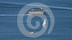 Excursion Ship and Sailboat in a Calm Sea