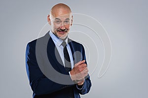 Excutive businessman wearing suit and standing against at isolated background